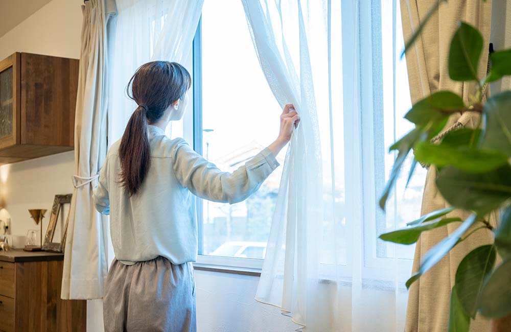 Woman Opening Window